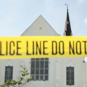 Police line tape at a church that says Do not cross